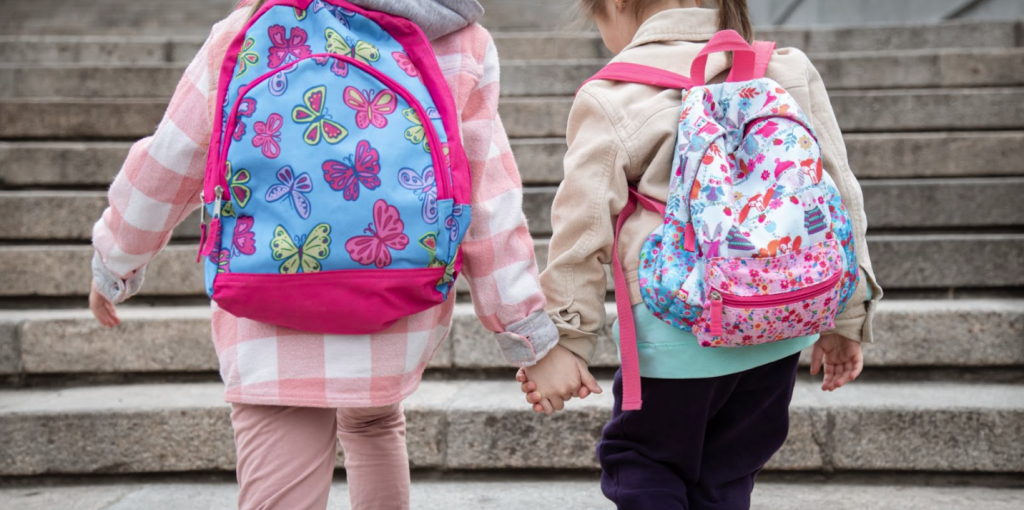Children with their school backpacks