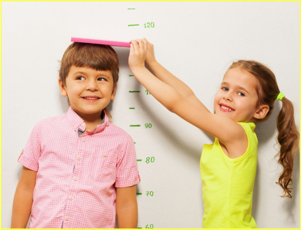 2 children are measuring their heights