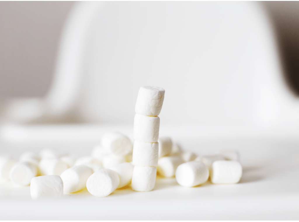 a marshmallow tower on a white background